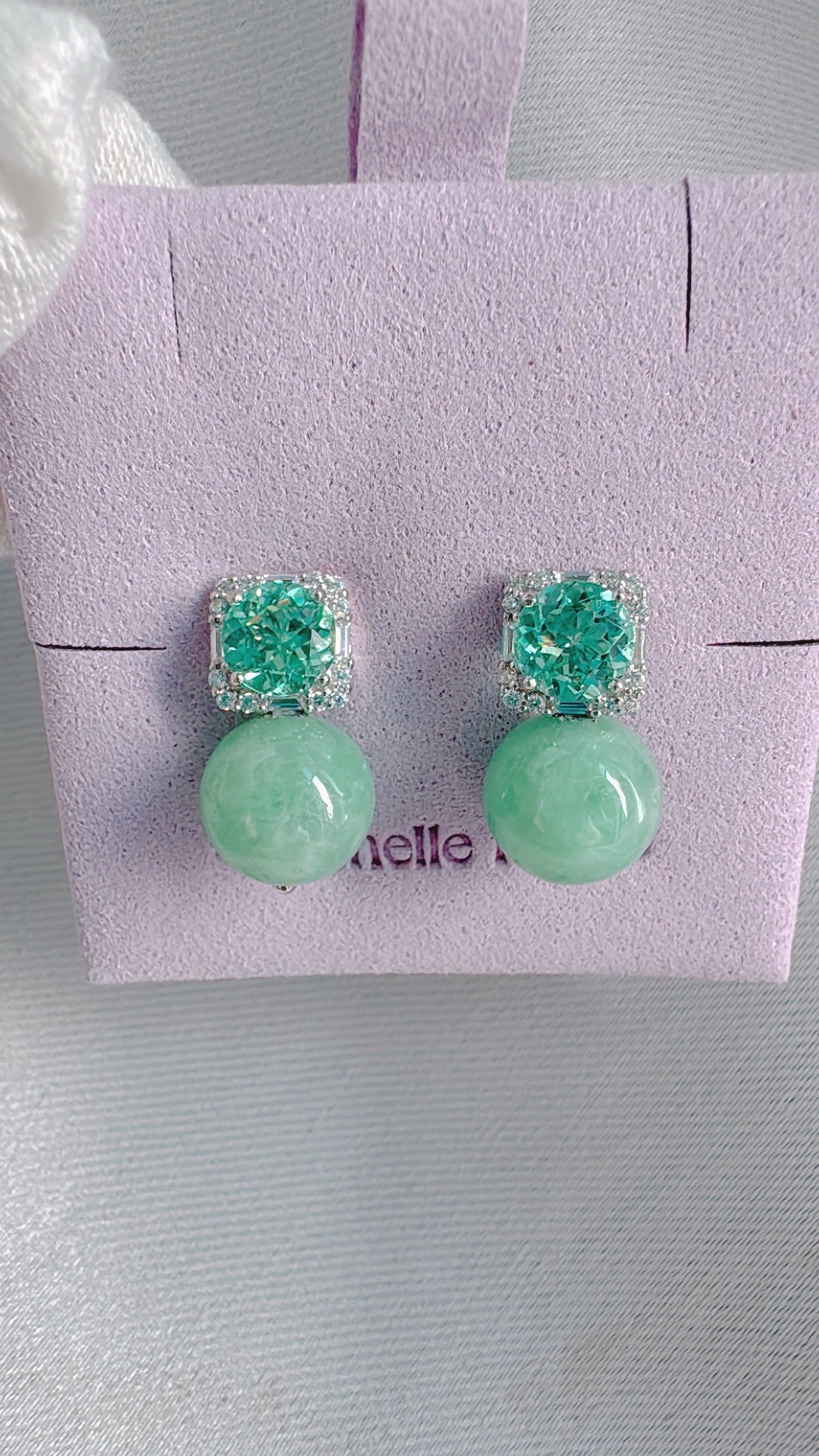 Poised Elegance earrings with mint lab sapphires and light apple-green jadeite, reference angle 1